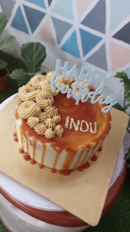 Salted caramel drip cake with buttercream rosettes
